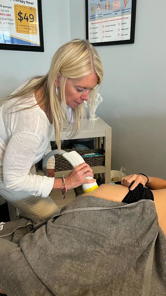 Dr. Kim Raby treating a patient with the SoftWave TRT applicator
